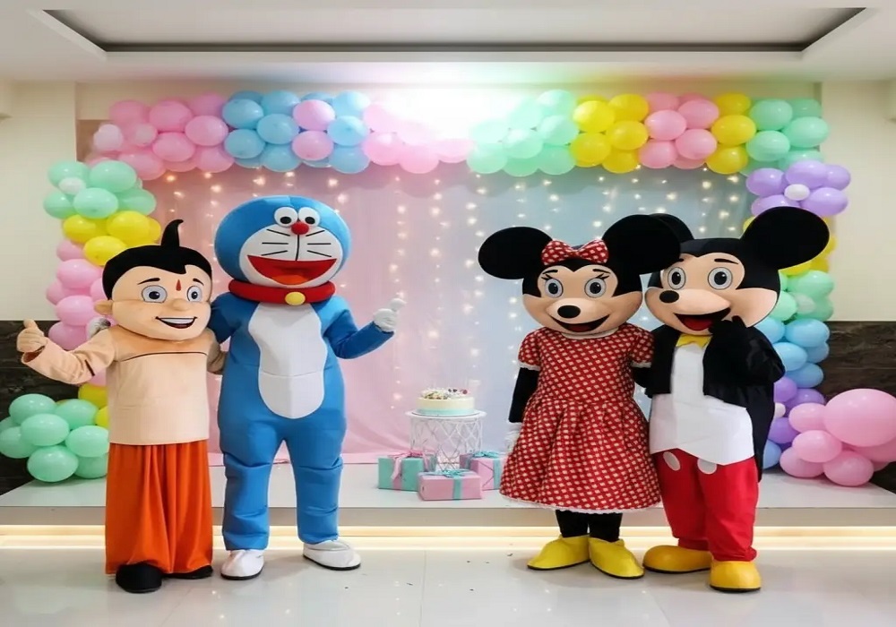 Character mascots entertaining guests at an indoor themed celebration event with balloon decorations