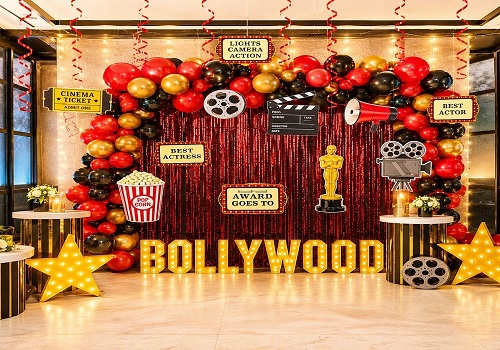 Bollywood theme party stage with colourful lighting and film-inspired decor