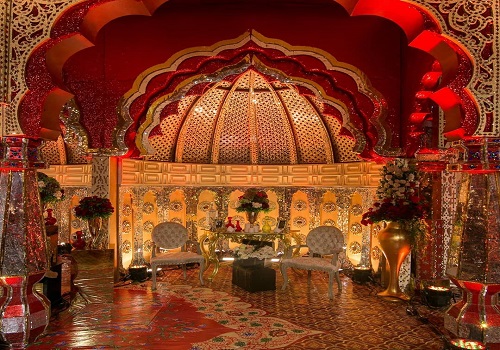 Mughal theme party backdrop inspired by carved stone jaali arch patterns